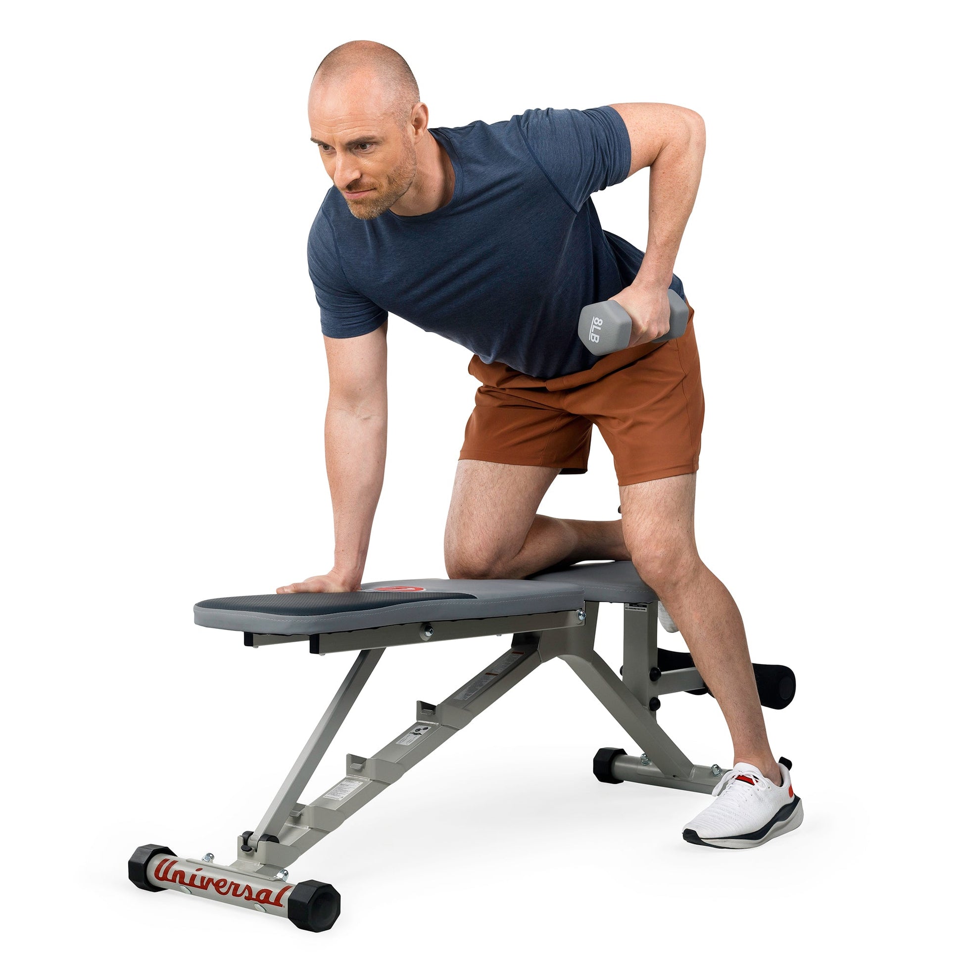 Man using the Universal UB300 Bench to work his triceps